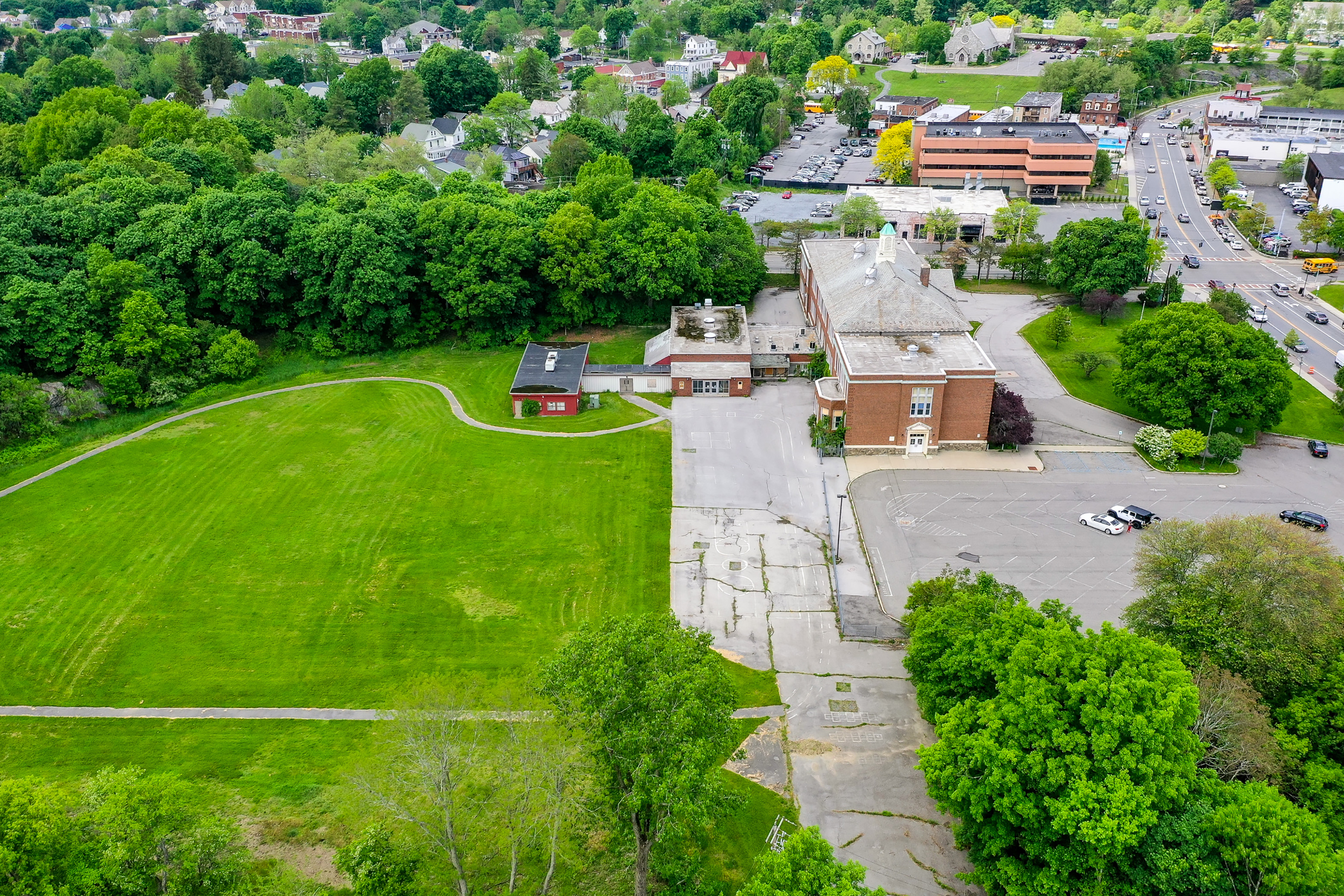 Aerial view of side of Raymond Ave School building