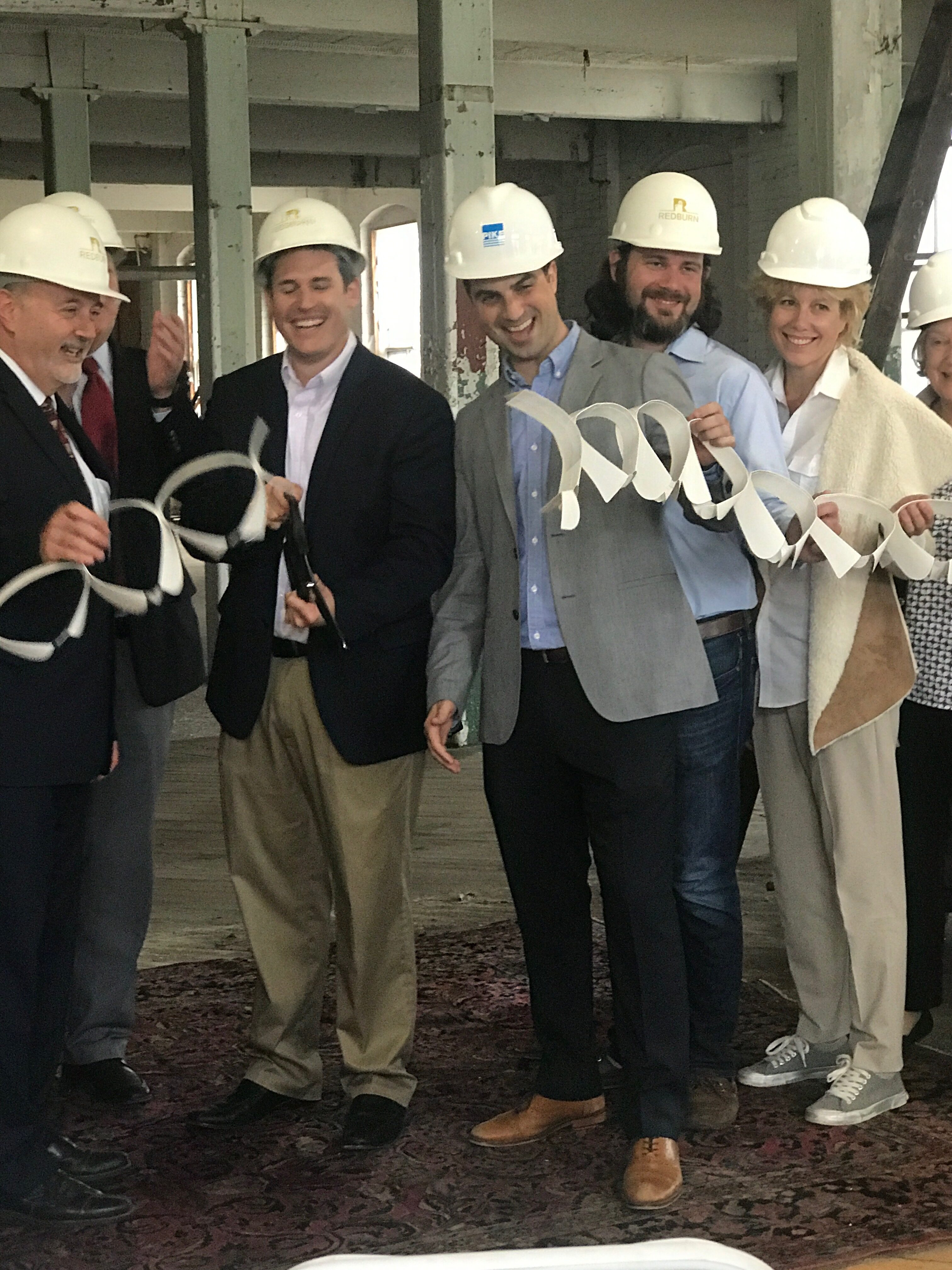 photo of ribbon cutting for the Collar Factory Lofts